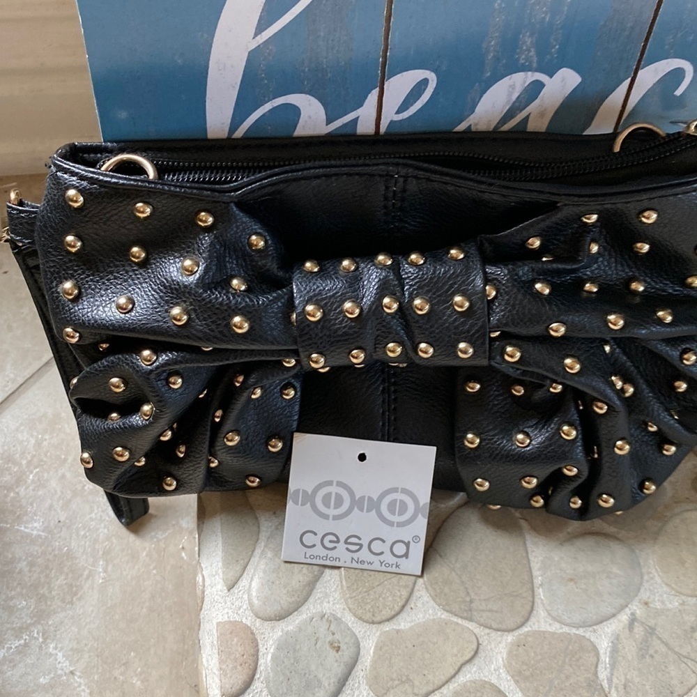 NWT Cesca New York/London black faux leather wristlet with gold River Bow design